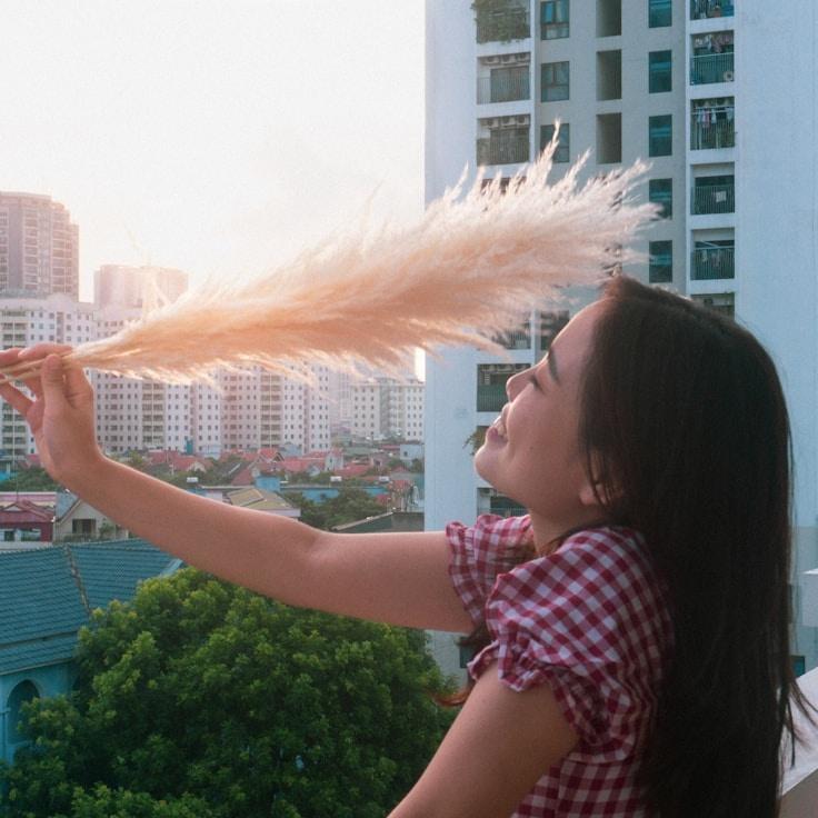 Kaveri Mehta, Lead Design Curator at Anchor Haven Matrix, reviewing corporate floral arrangements